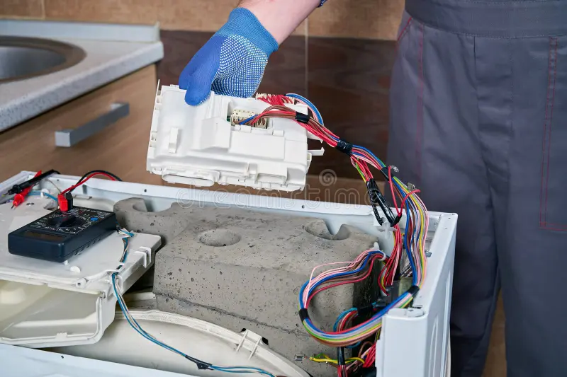 service-engineer-uniform-holds-electrical-control-unit-washing-machine-his-hand-electronic-module-replacement-445878336